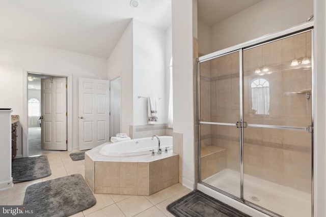 bathroom featuring tile patterned flooring, vanity, and independent shower and bath