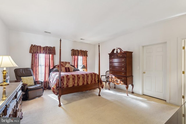 bedroom with light colored carpet