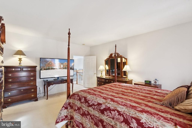 bedroom with light colored carpet