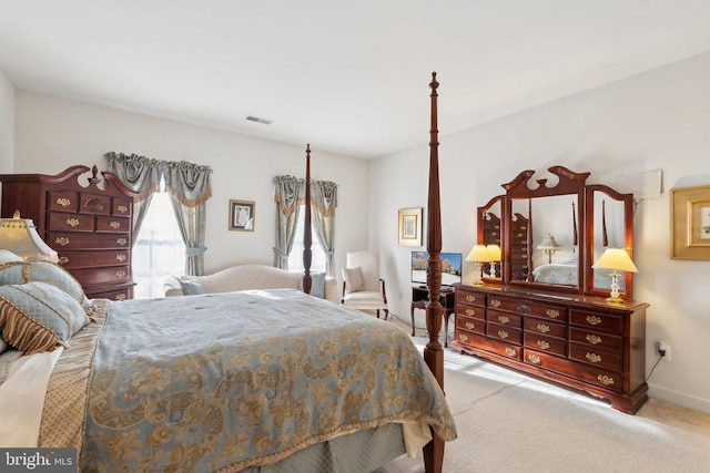 bedroom featuring light carpet