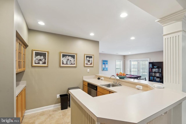 kitchen featuring kitchen peninsula, french doors, stainless steel dishwasher, and sink