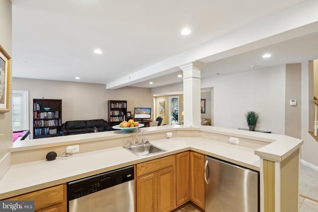 kitchen with beam ceiling, sink, stainless steel dishwasher, kitchen peninsula, and refrigerator