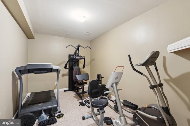 workout room with light colored carpet