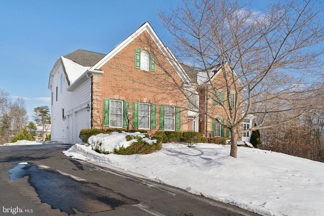 front of property with a garage