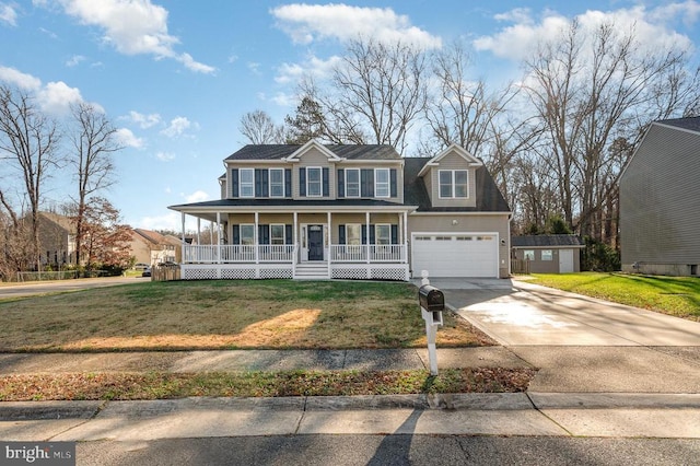 view of front facade featuring a front yard, a porch, and a garage