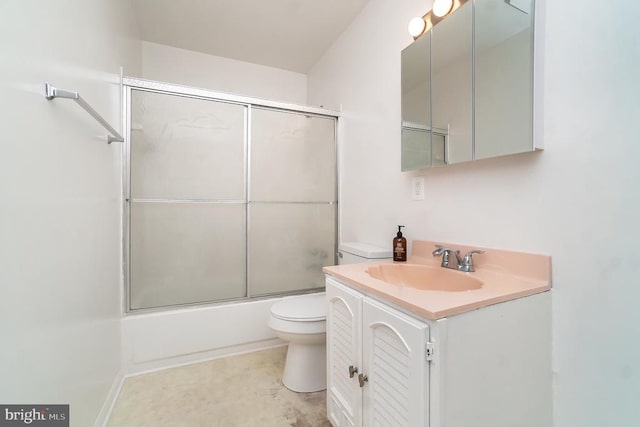 full bathroom featuring vanity, toilet, and shower / bath combination with glass door