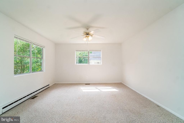 unfurnished room with ceiling fan, a healthy amount of sunlight, carpet floors, and a baseboard radiator