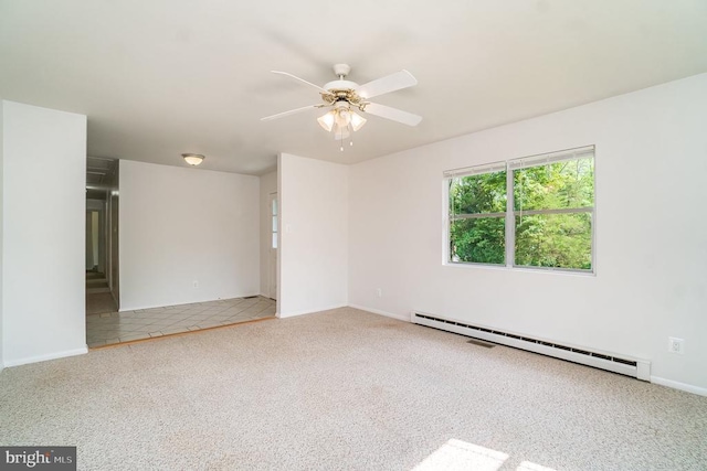 carpeted spare room featuring ceiling fan and a baseboard radiator