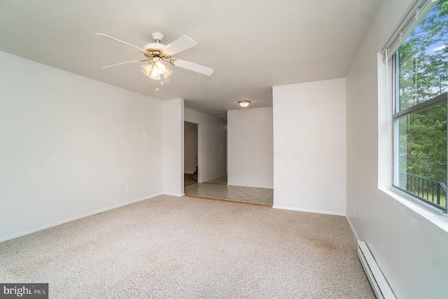 unfurnished room featuring carpet floors, baseboard heating, and ceiling fan