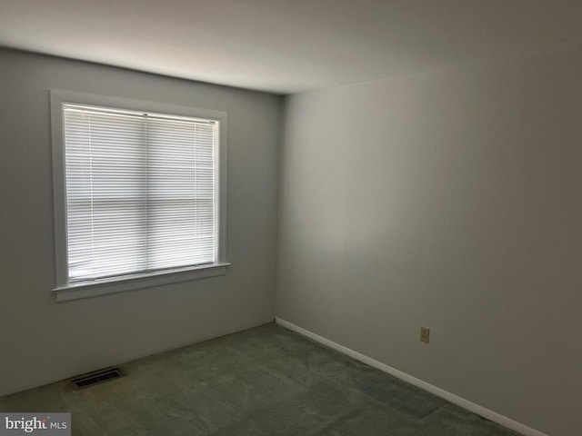 view of carpeted spare room