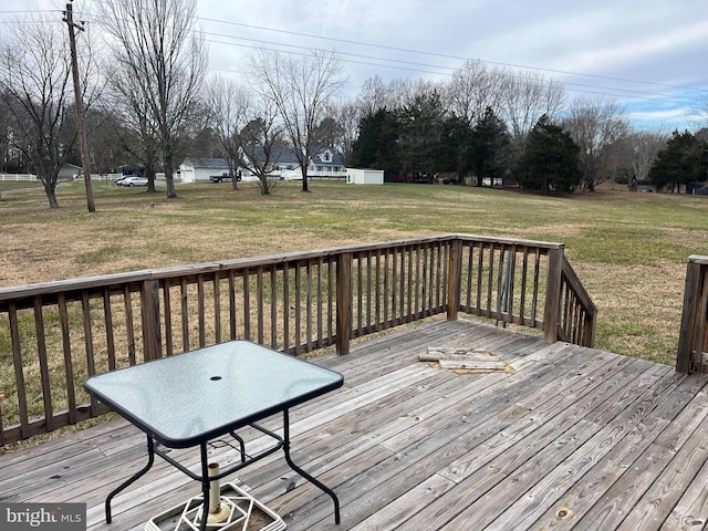 wooden terrace with a yard