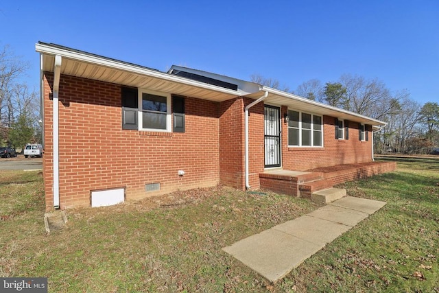 ranch-style house with a front lawn