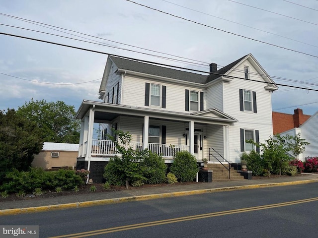 view of front of house featuring a porch and cooling unit