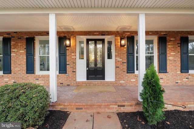 property entrance with covered porch