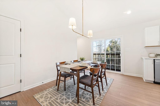 dining area with light hardwood / wood-style floors