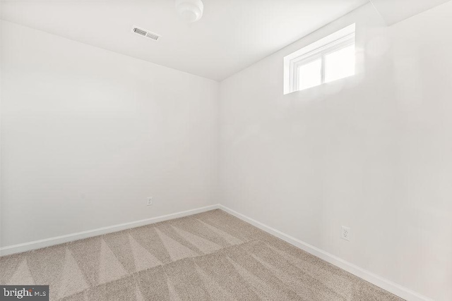 spare room featuring carpet floors