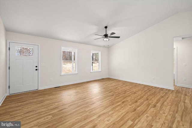 interior space featuring ceiling fan, light hardwood / wood-style flooring, and vaulted ceiling