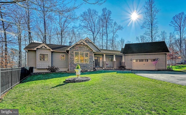 view of front of property with a garage and a front lawn