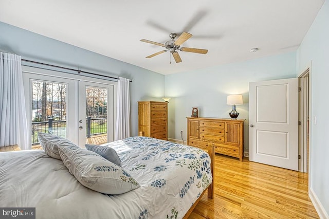 bedroom featuring french doors, access to outside, ceiling fan, and hardwood / wood-style floors