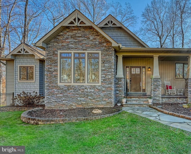 craftsman-style home featuring a front yard and a porch