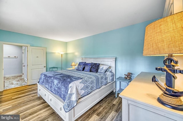 bedroom with hardwood / wood-style flooring