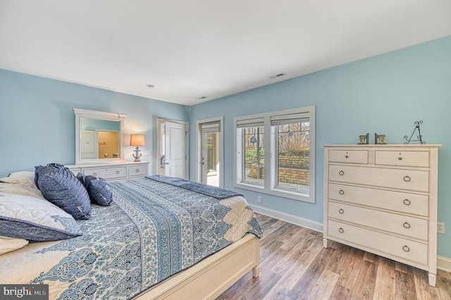 bedroom with light hardwood / wood-style flooring