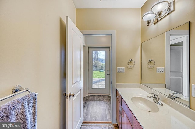 bathroom with vanity and hardwood / wood-style flooring