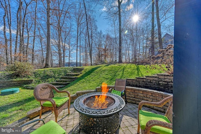 view of patio / terrace with an outdoor fire pit