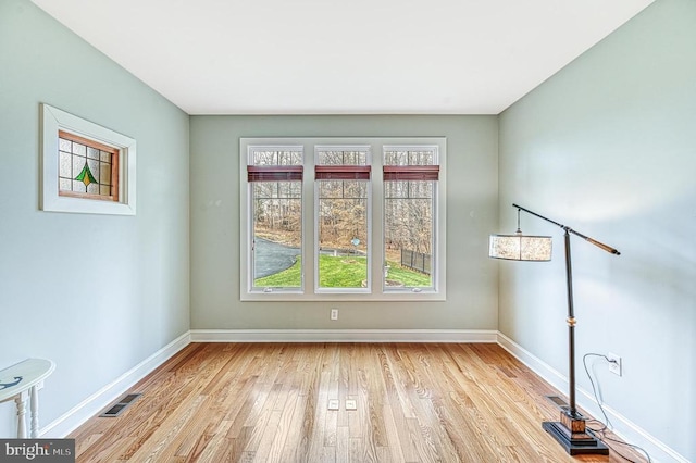 spare room featuring light hardwood / wood-style flooring