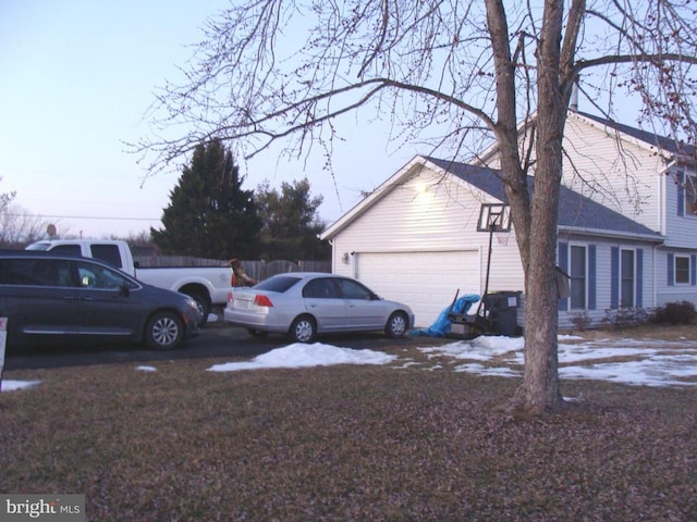 view of property exterior with a garage