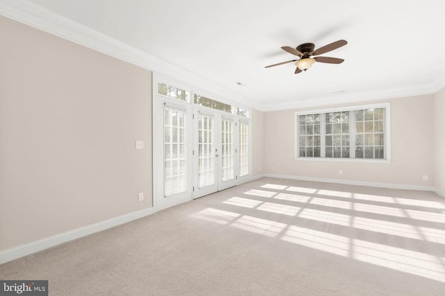 spare room with french doors, ceiling fan, and ornamental molding