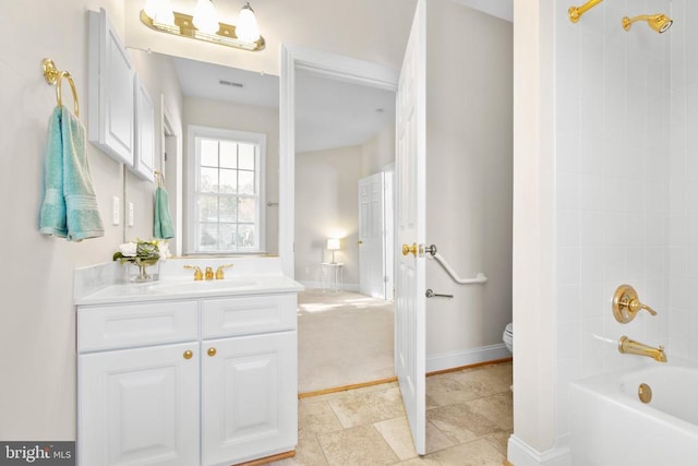 full bathroom featuring shower / tub combination, vanity, and toilet