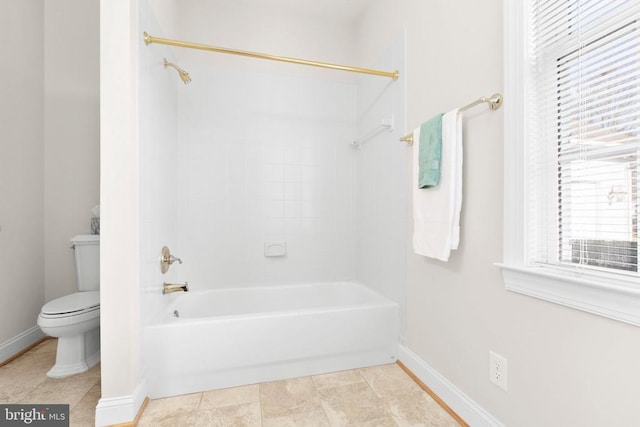 bathroom with toilet and tub / shower combination