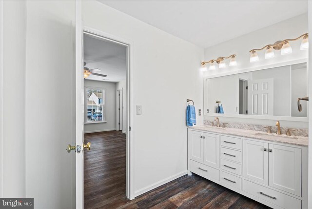 bathroom featuring ceiling fan, wood-type flooring, and vanity