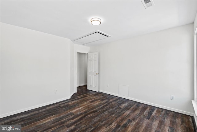 spare room with dark hardwood / wood-style floors