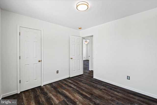 unfurnished bedroom featuring dark wood-type flooring