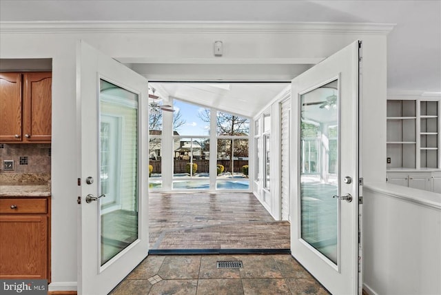 entryway with lofted ceiling and french doors