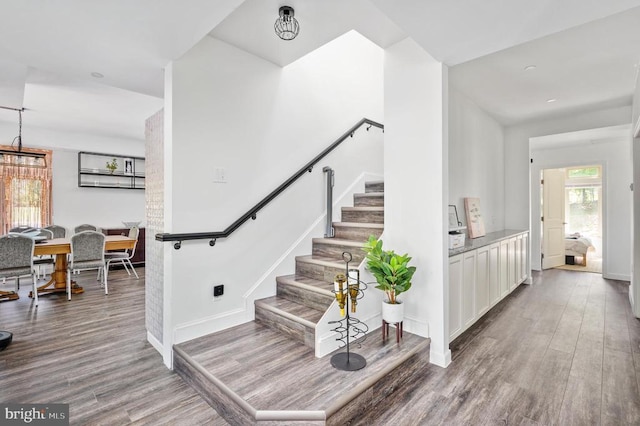 stairway featuring hardwood / wood-style flooring