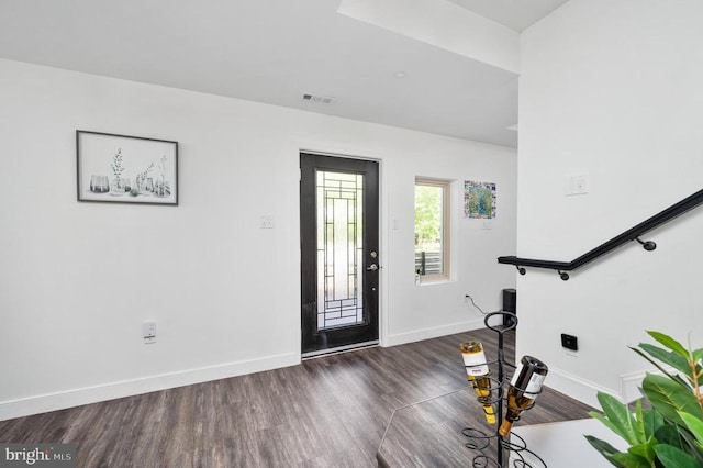 foyer entrance featuring dark wood-type flooring