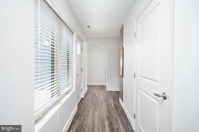 corridor featuring dark hardwood / wood-style flooring