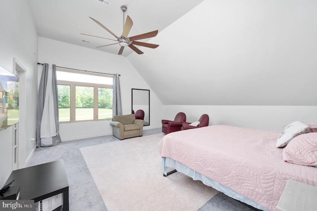 bedroom featuring ceiling fan, light carpet, and vaulted ceiling