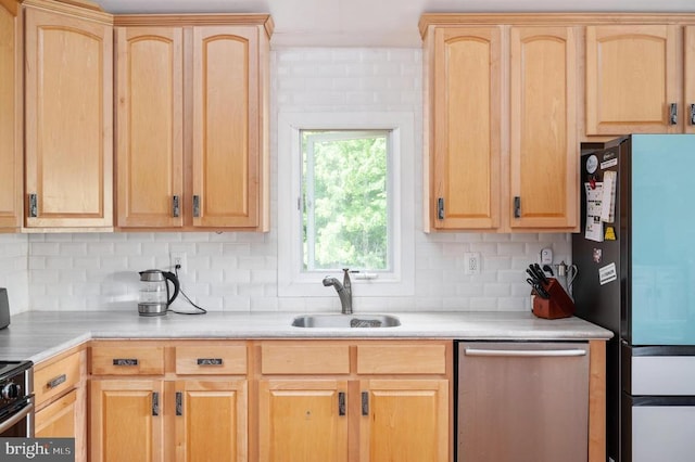 kitchen featuring dishwasher, refrigerator, sink, and light brown cabinetry