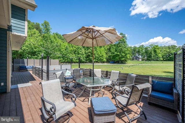 deck featuring a yard and an outdoor hangout area