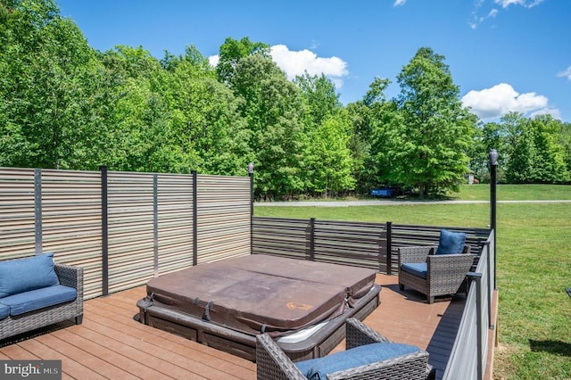 deck featuring a lawn and a covered hot tub