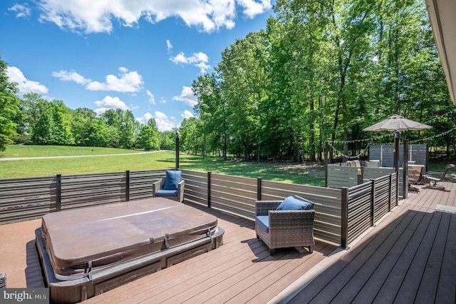 wooden terrace with a lawn and a covered hot tub