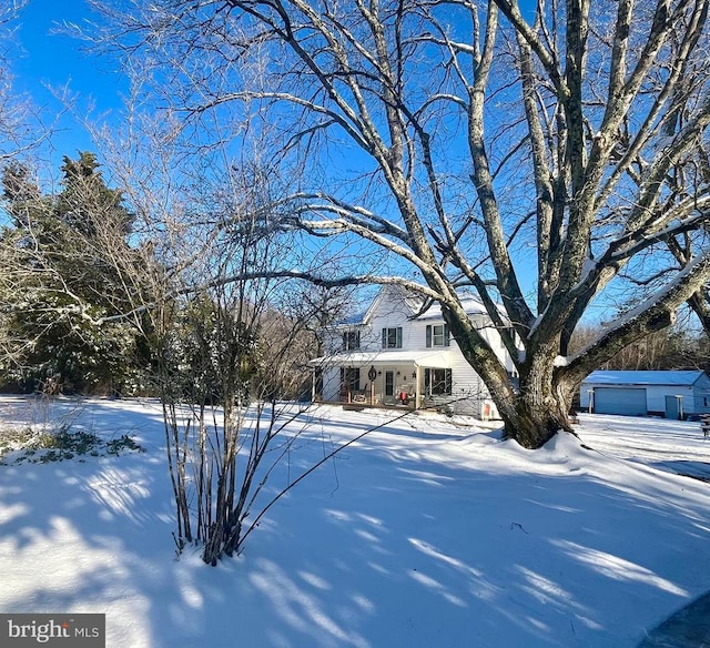 view of front of house with a garage and a porch