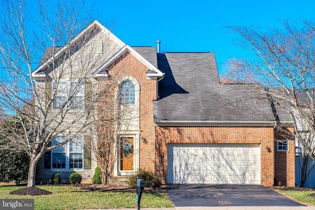 front of property with a garage