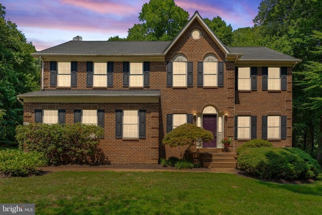 colonial house with a lawn