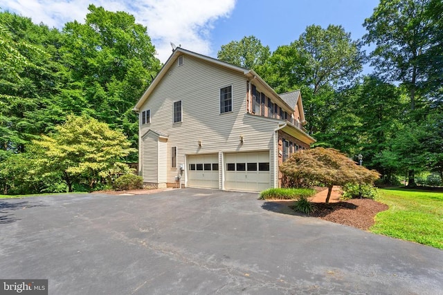 view of property exterior featuring a garage