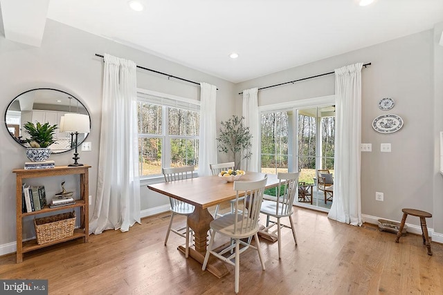 dining room featuring plenty of natural light and light hardwood / wood-style floors